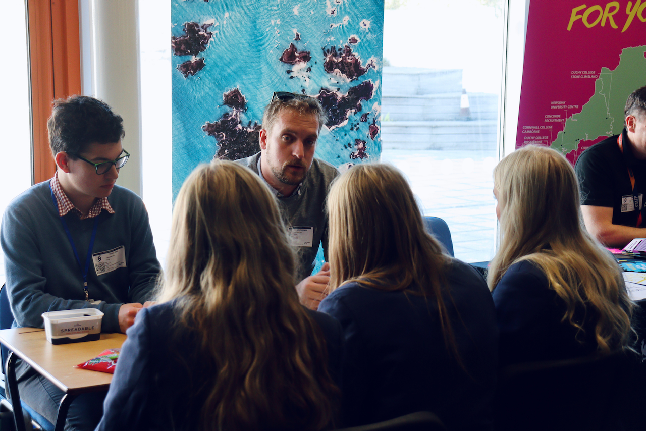 Image of Council officers Henry Dean and Ciaran Dean talking to students at the Five Islands Academy College and Careers Convention