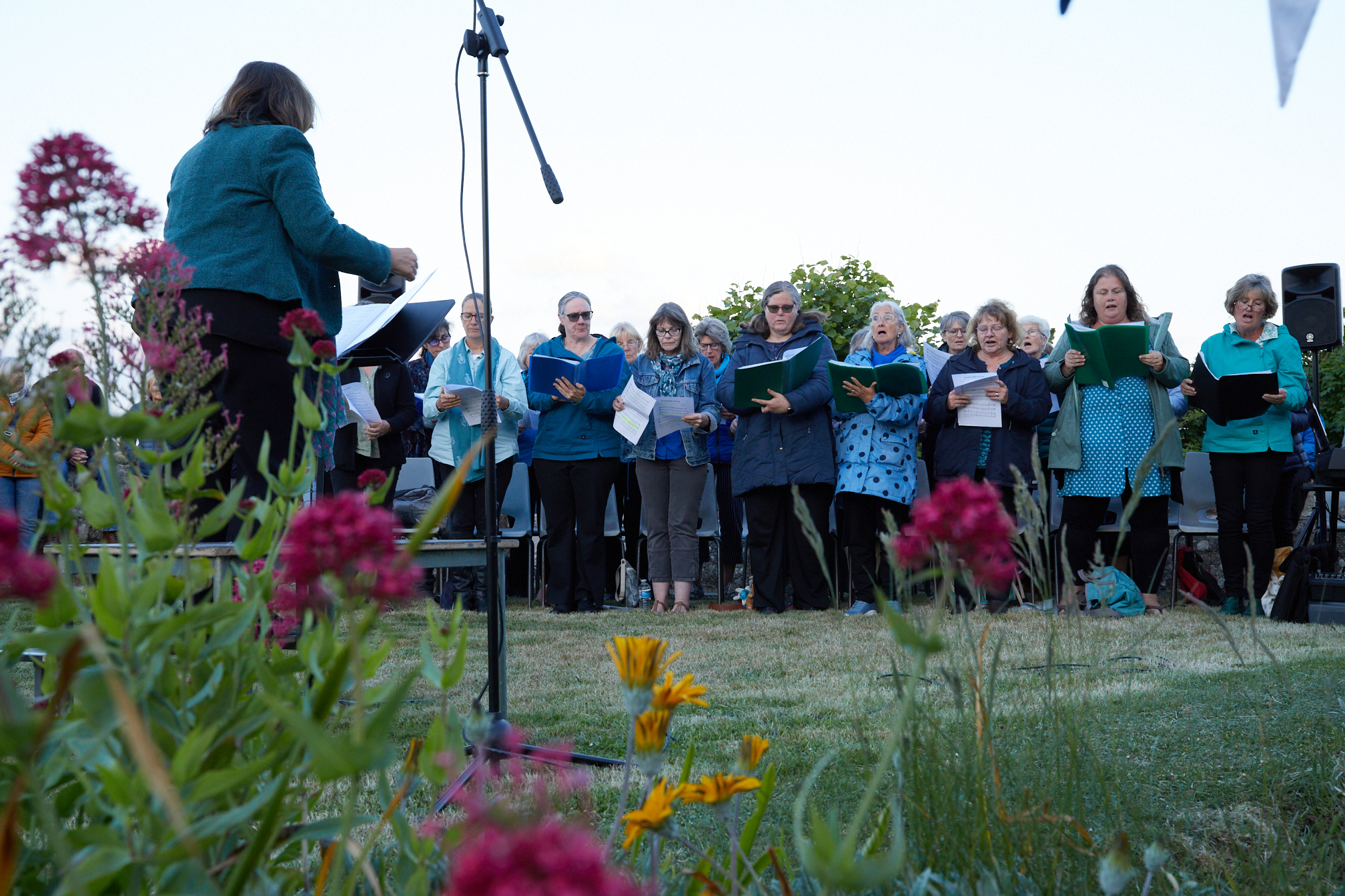 Local choir, the Scilly Sirens performing at the D-Day 80th Anniversary commemoration ceremony