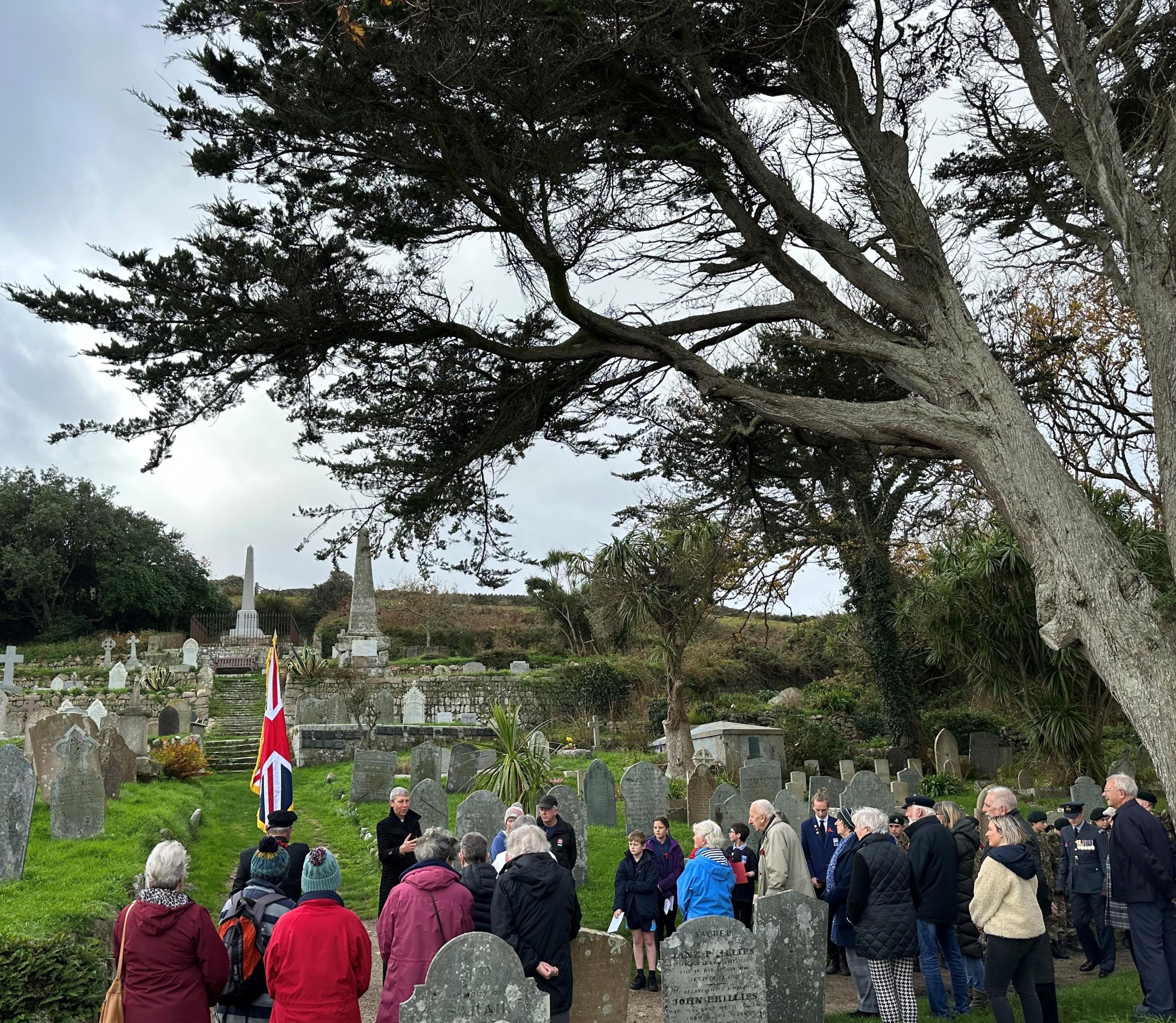 Image of people lining up ahead of the Act of Remembrance Service at Old Town Churchyard, on St Mary's