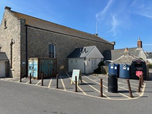 Image of the Town Hall on St Mary's with 2 bottle banks and a Salvation Army clothes bank located in the adjacent car park. 